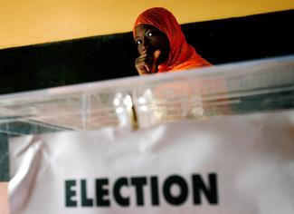 A Senegalese woman waits to cast her ballot at a voting station during presidential elections in the capital Dakar, February 25 2007