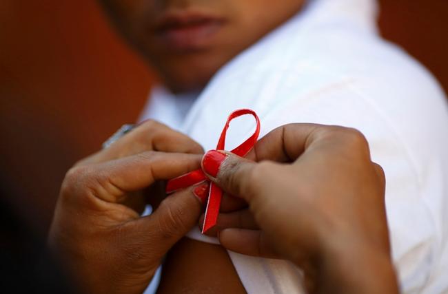 Child with the AIDS ribbon